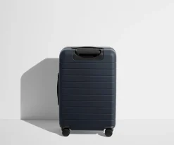 The Bigger Carry-On Flex in Navy Blue